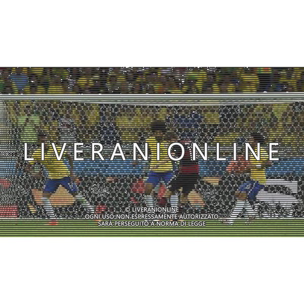 (140708) -- BELO HORIZONTE, July 8, 2014 () -- Germany\'s Thomas Muller (2nd R) shoots the ball during a semifinal match between Brazil and Germany of 2014 FIFA World Cup at the Estadio Mineirao Stadium in Belo Horizonte, Brazil, on July 8, 2014. Germany won 7-1 over Brazil and qualified for the final on Tuesday. (/Qi Heng)(pcy) ©photoshot/Agenzia Aldo Liverani sas - ITALY ONLY - EDITORIAL USE ONLY - BRASILE VS GERMANIA partita di semifinale Coppa del mondo FIFA 2014 Mineirao stadio Estadio a Belo Horizonte, in Brasile, 8 luglio 2014, la Germania ha vinto 7-1 e qualificato per la finale