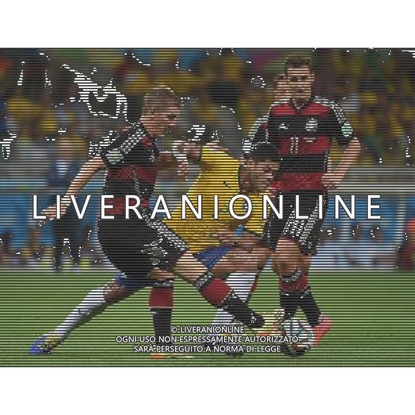 (140708) -- BELO HORIZONTE, July 8, 2014 () -- Germany\'s Bastian Schweinsteiger (L, front) vies with Brazil\'s Hulk (R, front) during a semifinal match between Brazil and Germany of 2014 FIFA World Cup at the Estadio Mineirao Stadium in Belo Horizonte, Brazil, on July 8, 2014. Germany won 7-1 over Brazil and qualified for the final on Tuesday. (/Li Ga)(pcy) ©photoshot/Agenzia Aldo Liverani sas - ITALY ONLY - EDITORIAL USE ONLY - BRASILE VS GERMANIA partita di semifinale Coppa del mondo FIFA 2014 Mineirao stadio Estadio a Belo Horizonte, in Brasile, 8 luglio 2014, la Germania ha vinto 7-1 e qualificato per la finale