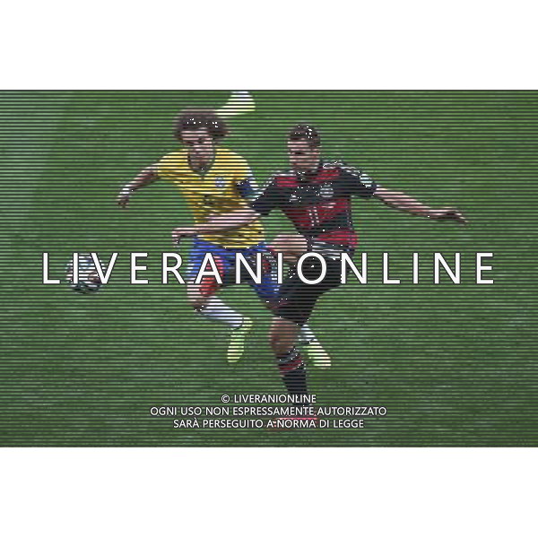 (140708) -- BELO HORIZONTE, July 8, 2014 () -- Germany\'s Miroslav Klose (R) vies with Brazil\'s David Luiz during a semifinal match between Brazil and Germany of 2014 FIFA World Cup at the Estadio Mineirao Stadium in Belo Horizonte, Brazil, on July 8, 2014. Germany won 7-1 over Brazil and qualified for the final on Tuesday. (/Li Ming)(pcy) ©photoshot/Agenzia Aldo Liverani sas - ITALY ONLY - EDITORIAL USE ONLY - BRASILE VS GERMANIA partita di semifinale Coppa del mondo FIFA 2014 Mineirao stadio Estadio a Belo Horizonte, in Brasile, 8 luglio 2014, la Germania ha vinto 7-1 e qualificato per la finale