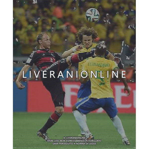 (140708) -- BELO HORIZONTE, July 8, 2014 () -- Germany\'s Benedikt Howedes (L) vies with Brazil\'s David Luiz (C) during a semifinal match between Brazil and Germany of 2014 FIFA World Cup at the Estadio Mineirao Stadium in Belo Horizonte, Brazil, on July 8, 2014. Germany won 7-1 over Brazil and qualified for the final on Tuesday. (/Liu Dawei)(pcy) ©photoshot/Agenzia Aldo Liverani sas - ITALY ONLY - EDITORIAL USE ONLY - BRASILE VS GERMANIA partita di semifinale Coppa del mondo FIFA 2014 Mineirao stadio Estadio a Belo Horizonte, in Brasile, 8 luglio 2014, la Germania ha vinto 7-1 e qualificato per la finale