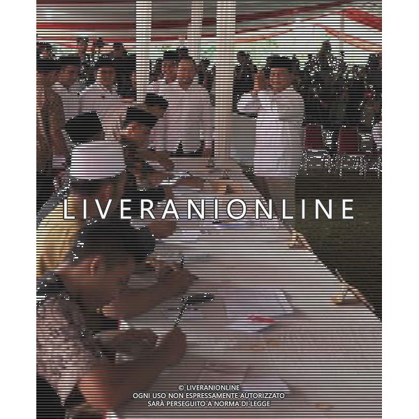 (140709) -- BONGOR, July 9, 2014 () -- Polling officers check the identity of presidential candidate Prabowo Subianto at a polling station in Bogor of West Java Province, Indonesia, July 8, 2014. Indonesians went to polls on July 9 to elect their new president from Jakarta Governor Joko Widodo, 53, and former general Prabowo Subianto, 63. (/He Changshan) ©photoshot/Agenzia Aldo Liverani sas - ITALY ONLY - EDITORIAL USE ONLY - Operazioni di voto in un seggio elettorale a Bogor della provincia di West Java, Indonesia, 8 Luglio 2014 per le elezioni presidenziali