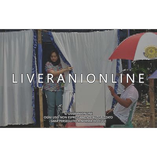 (140709) -- TANGERANG, July 9, 2014 () -- A woman comes out from a voting booth at a polling station in Tangerang, Indonesia, July 9, 2014. Indonesia held presidential election on Wednesday. (/Agung Kuncahya B.) ©PHOTOSHOT/Agenzia Aldo Liverani sas - ITALY ONLY - EDITORIAL USE ONLY - Operazioni di voto in un seggio elettorale a Bogor della provincia di West Java, Indonesia, 8 Luglio 2014 per le elezioni presidenziali