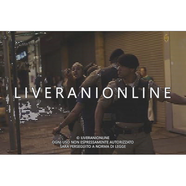 (140708) -- BELO HORIZONTE, July 8, 2014 (Xinhua) -- Police officers arrest overreacting football fans after a semifinal match between Brazil and Germany of 2014 FIFA World Cup at the Savassi Plaza in Belo Horizonte, Brazil, on July 8, 2014. (Xinhua/Mauricio Valenzuela) ©PHOTOSHOT/Agenzia Aldo Liverani sas - ITALY ONLY - EDITORIAL USE ONLY - BRASILE VS GERMANIA partita di semifinale Coppa del mondo FIFA 2014 Mineirao stadio Estadio a Belo Horizonte, in Brasile, 8 luglio 2014, la Germania ha vinto 7-1 e qualificato per la finale