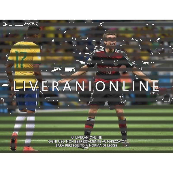(140708) -- BELO HORIZONTE, July 8, 2014 () -- Germany\'s Thomas Muller (R) reacts during a semifinal match between Brazil and Germany of 2014 FIFA World Cup at the Estadio Mineirao Stadium in Belo Horizonte, Brazil, on July 8, 2014. Germany won 7-1 over Brazil and qualified for the final on Tuesday.(/Li Ga)(rh) ©photoshot/Agenzia Aldo Liverani sas - ITALY ONLY - EDITORIAL USE ONLY - BRASILE VS GERMANIA partita di semifinale Coppa del mondo FIFA 2014 Mineirao stadio Estadio a Belo Horizonte, in Brasile, 8 luglio 2014, la Germania ha vinto 7-1 e qualificato per la finale