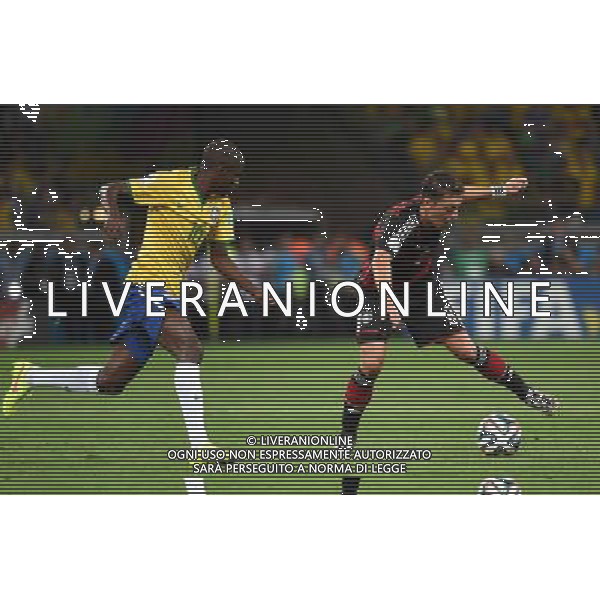 (140708) -- BELO HORIZONTE, July 8, 2014 () -- Brazil\'s Ramires vies with Germany\'s Mesut Ozil during a semifinal match between Brazil and Germany of 2014 FIFA World Cup at the Estadio Mineirao Stadium in Belo Horizonte, Brazil, on July 8, 2014. Germany won 7-1 over Brazil and qualified for the final on Tuesday.(/Li Ga)(rh) ©photoshot/Agenzia Aldo Liverani sas - ITALY ONLY - EDITORIAL USE ONLY - BRASILE VS GERMANIA partita di semifinale Coppa del mondo FIFA 2014 Mineirao stadio Estadio a Belo Horizonte, in Brasile, 8 luglio 2014, la Germania ha vinto 7-1 e qualificato per la finale