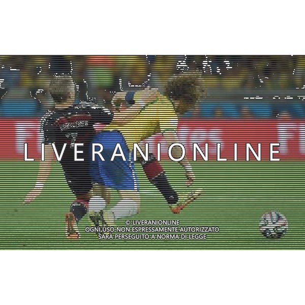 (140708) -- BELO HORIZONTE, July 8, 2014 () -- Germany\'s Bastian Schweinsteiger (L) vies with Brazil\'s David Luiz during a semifinal match between Brazil and Germany of 2014 FIFA World Cup at the Estadio Mineirao Stadium in Belo Horizonte, Brazil, on July 8, 2014. Germany won 7-1 over Brazil and qualified for the final on Tuesday. (/Liu Dawei)(pcy) ©photoshot/Agenzia Aldo Liverani sas - ITALY ONLY - EDITORIAL USE ONLY - BRASILE VS GERMANIA partita di semifinale Coppa del mondo FIFA 2014 Mineirao stadio Estadio a Belo Horizonte, in Brasile, 8 luglio 2014, la Germania ha vinto 7-1 e qualificato per la finale
