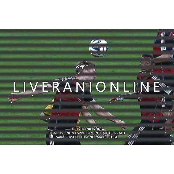 (140708) -- BELO HORIZONTE, July 8, 2014 () -- Germany\'s Per Mertesacker (front, L) heads the ball during a semifinal match between Brazil and Germany of 2014 FIFA World Cup at the Estadio Mineirao Stadium in Belo Horizonte, Brazil, on July 8, 2014. Germany won 7-1 over Brazil and qualified for the final on Tuesday. (/Liu Bin)(pcy) ©photoshot/Agenzia Aldo Liverani sas - ITALY ONLY - EDITORIAL USE ONLY - BRASILE VS GERMANIA partita di semifinale Coppa del mondo FIFA 2014 Mineirao stadio Estadio a Belo Horizonte, in Brasile, 8 luglio 2014, la Germania ha vinto 7-1 e qualificato per la finale
