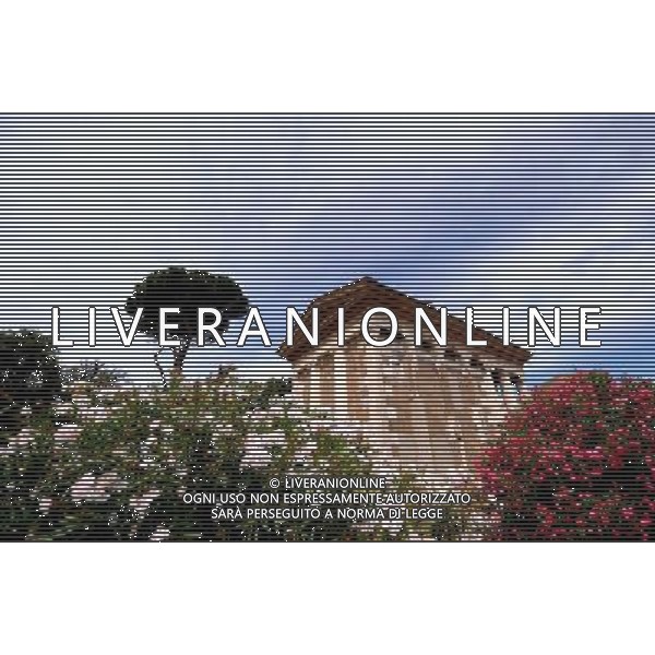 (140710) -- ROME, July 10, 2014 () -- Photo taken on July 10, 2014 shows the reopened Temple of Portunus in Rome, capital of Italy. The Temple of Portunus reopened here Wednesday after a long time restoration supported by World Monuments Fund. Temple of Portunus was built in 75 BC, and it was the main temple dedicated to the God Portunus in Rome. (/Xu Nizhi) (zjl) ©PHOTOSHOT/Agenzia Aldo Liverani sas - - ITALY ONLY - EDITORIAL USE ONLY - Riapertura del Tempio di Portuno a Roma, in Italia, 10 luglio 2014 dopo un lungo restauro sostenuto dalla World Monuments Fund, fu costruito nel 75 aC, ed era il tempio principale dedicato al dio Portunus a Roma