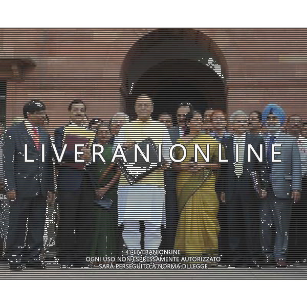 (140710) -- NEW DELHI, July 10, 2014 () -- Indian Finance Minister Arun Jaitley (C) poses for photos in front of his office at North Block before presenting the first budget of the Modi government to the Parliament in New Delhi, India, July 10, 2014. India will revive special industrial zones to attract foreign investment and will set up smart cities in seven cities, said Finance Minister Arun Jaitley (/Partha Sarkar) ©photoshot/Agenzia Aldo Liverani sas - ITALY ONLY - EDITORIAL USE ONLY ©PHOTOSHOT/Agenzia Aldo Liverani sas - - ITALY ONLY - EDITORIAL USE ONLY - Il ministro delle Finanze indiano Arun Jaitley dopo aver dato il tocco finale al bilancio generale dell\'India 2014-15 a New Delhi, India, 9 LUGLIO 2014