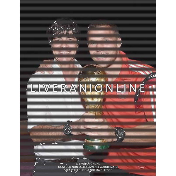 firo : 13.07.2014 Fu§ball, Fussball, WM 2014 Brasilien, Weltmeisterschaft 2014 Brasilien, Football World Championships Brazil 2014, 2014 FIFA WORLD CUP BRAZIL,Brasil,Bresil, WM-Finale 2014, Endspiel 2014, Finale 2014, GER, Deutschland - ARG, Argentinien 1:0 Weltmeister 2014 Deutschland, Lukas PODOLSKI (Deutschland)/r und Bundestrainer / Trainer Joachim Jogi LOEW, L…W (Deutschland)/l mit dem Weltpokal / WM-Pokal. DFB-WM Party/ Gala / Feier nach dem Finale im Hotel Sheraton Rio de Janeiro. $worldrights Es gelten unsere AGB, einsehbar auf www.firosportphoto.de Poolfoto : GES, copyright by firo sportphoto, Coesfelder Str.207 48249 DŸlmen www.firosportphoto.de mail@firosportphoto.de (V o l k s b a n k B o c h u m - W i t t e n ) BLZ.: 430 601 29 Kt. Nr.: 341 117 100 Tel:Ê 02594 - 9916004 Fax:Ê02594 - 9916005 AG ALDO LIVERANI SAS ONLY ITALY *** Local Caption ***