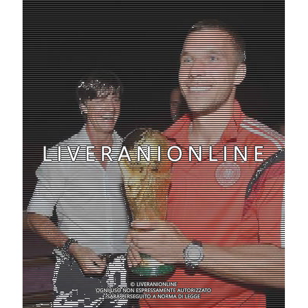 firo : 13.07.2014 Fu§ball, Fussball, WM 2014 Brasilien, Weltmeisterschaft 2014 Brasilien, Football World Championships Brazil 2014, 2014 FIFA WORLD CUP BRAZIL,Brasil,Bresil, WM-Finale 2014, Endspiel 2014, Finale 2014, GER, Deutschland - ARG, Argentinien 1:0 Weltmeister 2014 Deutschland, Lukas PODOLSKI (Deutschland)/r und Bundestrainer / Trainer Joachim Jogi LOEW, L…W (Deutschland)/l mit dem Weltpokal / WM-Pokal. DFB-WM Party/ Gala / Feier nach dem Finale im Hotel Sheraton Rio de Janeiro. $worldrights Es gelten unsere AGB, einsehbar auf www.firosportphoto.de Poolfoto : GES, copyright by firo sportphoto, Coesfelder Str.207 48249 DŸlmen www.firosportphoto.de mail@firosportphoto.de (V o l k s b a n k B o c h u m - W i t t e n ) BLZ.: 430 601 29 Kt. Nr.: 341 117 100 Tel:Ê 02594 - 9916004 Fax:Ê02594 - 9916005 AG ALDO LIVERANI SAS ONLY ITALY *** Local Caption ***