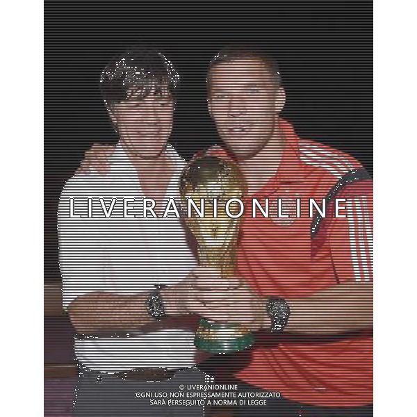 firo : 13.07.2014 Fu§ball, Fussball, WM 2014 Brasilien, Weltmeisterschaft 2014 Brasilien, Football World Championships Brazil 2014, 2014 FIFA WORLD CUP BRAZIL,Brasil,Bresil, WM-Finale 2014, Endspiel 2014, Finale 2014, GER, Deutschland - ARG, Argentinien 1:0 Weltmeister 2014 Deutschland, Lukas PODOLSKI (Deutschland)/r und Bundestrainer / Trainer Joachim Jogi LOEW , L…W,(Deutschland)/l mit dem Weltpokal / WM-Pokal. DFB-WM Party/ Gala / Feier nach dem Finale im Hotel Sheraton Rio de Janeiro. $worldrights Es gelten unsere AGB, einsehbar auf www.firosportphoto.de Poolfoto : GES, copyright by firo sportphoto, Coesfelder Str.207 48249 DŸlmen www.firosportphoto.de mail@firosportphoto.de (V o l k s b a n k B o c h u m - W i t t e n ) BLZ.: 430 601 29 Kt. Nr.: 341 117 100 Tel:Ê 02594 - 9916004 Fax:Ê02594 - 9916005 AG ALDO LIVERANI SAS ONLY ITALY *** Local Caption ***