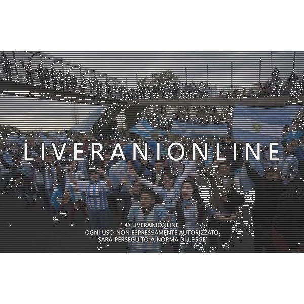 (140715) -- EZEIZA, July 15, 2014 () -- Argentinian fans rally to welcome their national football team upon their arrival, in Ezeiza city, Argentina, on July 14, 2014. Argentina National Team returned after won the silver in the 2014 FIFA World Cup Brazil.(/Martin Zabala) (da) (sp) ©PHOTOSHOT/Agenzia Aldo Liverani sas - ITALY ONLY - EDITORIAL USE ONLY - I tifosi accolgono la quadra nazionale di calcio dell\'argentina al loro arrivo, nei pressi della Federcalcio), nella citta\' di Ezeiza, 14 luglio 2014 dopo aver vinto l\'argento alla coppa del mondo FIFA 2014 in Brasile