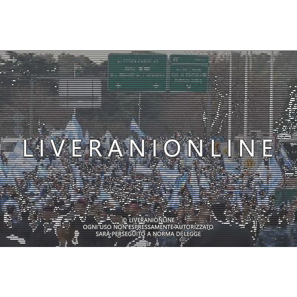 (140715) -- EZEIZA, July 15, 2014 () -- Argentinian fans rally to welcome their national football team upon their arrival,near the Argentine Football Association (AFA, its acronym in Spanish), in the city of Ezeiza, Argentina, on July 14, 2014. Argentina National Team returned after won the silver in the 2014 FIFA World Cup Brazil. (/Martin Zabala) (jp) (ah) ©PHOTOSHOT/Agenzia Aldo Liverani sas - ITALY ONLY - EDITORIAL USE ONLY - I tifosi accolgono la quadra nazionale di calcio dell\'argentina al loro arrivo, nei pressi della Federcalcio), nella citta\' di Ezeiza, 14 luglio 2014 dopo aver vinto l\'argento alla coppa del mondo FIFA 2014 in Brasile