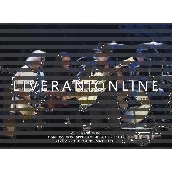 Neil Young and Crazy Horse performing at Liverpool Echo Arena, England on 13th July 2014. Guitarist Frank Sampedro; Bassist Rick Rosas; lead singer/guitarist Neil Young; drummer Ralf Molina. ©PHOTOSHOT/Agenzia Aldo Liverani sas - ITALY ONLY - EDITORIAL USE ONLY