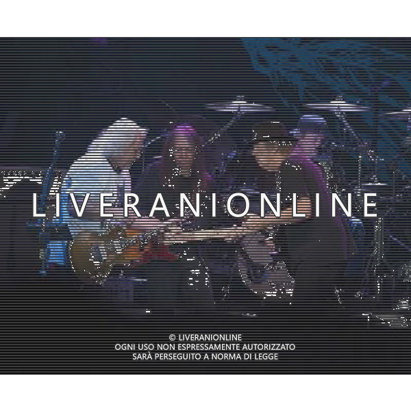 Neil Young and Crazy Horse performing at Liverpool Echo Arena, England on 13th July 2014. Guitarist Frank Sampedro; Bassist Rick Rosas; lead singer/guitarist Neil Young; drummer Ralf Molina. ©PHOTOSHOT/Agenzia Aldo Liverani sas - ITALY ONLY - EDITORIAL USE ONLY