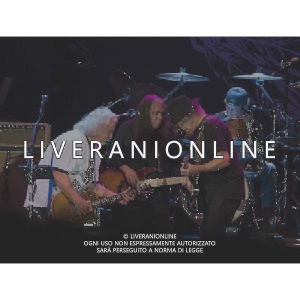 Neil Young and Crazy Horse performing at Liverpool Echo Arena, England on 13th July 2014. Guitarist Frank Sampedro; Bassist Rick Rosas; lead singer/guitarist Neil Young; drummer Ralf Molina. ©PHOTOSHOT/Agenzia Aldo Liverani sas - ITALY ONLY - EDITORIAL USE ONLY
