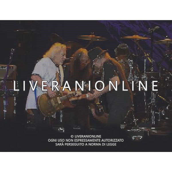 Neil Young and Crazy Horse performing at Liverpool Echo Arena, England on 13th July 2014. Guitarist Frank Sampedro; Bassist Rick Rosas; lead singer/guitarist Neil Young; drummer Ralf Molina. ©PHOTOSHOT/Agenzia Aldo Liverani sas - ITALY ONLY - EDITORIAL USE ONLY