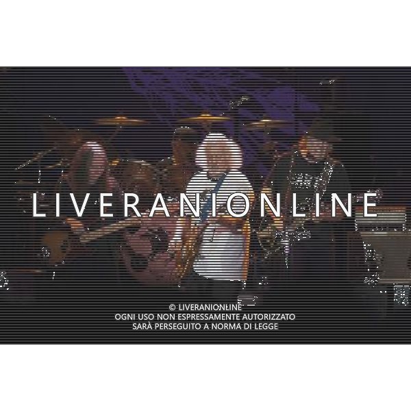 Neil Young and Crazy Horse performing at Liverpool Echo Arena, England on 13th July 2014. Bassist Rick Rosas; drummer Ralf Molina; Guitarist Frank Sampedro; lead singer/guitarist Neil Young. ©PHOTOSHOT/Agenzia Aldo Liverani sas - ITALY ONLY - EDITORIAL USE ONLY
