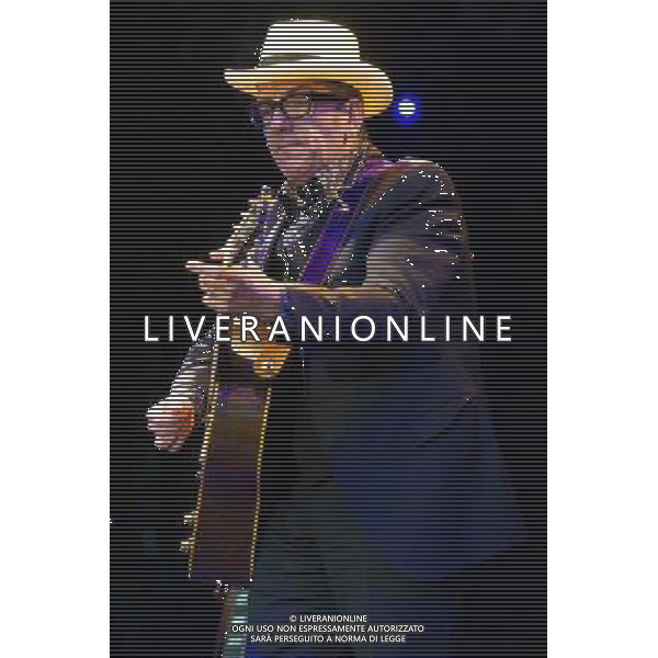 English singer-songwriter Elvis Costello performs at Kew Gardens, Richmond, Greater London, England, UK on Wednesday 16th July 2014 as part of the Kew The Music Series of concerts. Costello lived locally in Twickenham and the gig is billed as a homecoming gig. ©PHOTOSHOT/Agenzia Aldo Liverani sas - ITALY ONLY - EDITORIAL USE ONLY