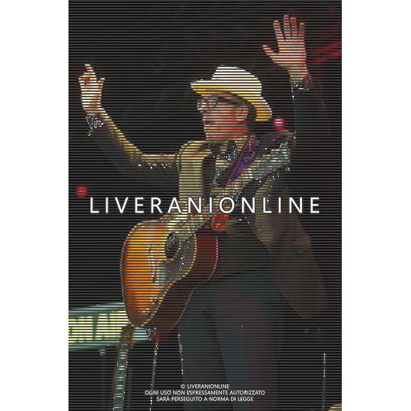 English singer-songwriter Elvis Costello performs at Kew Gardens, Richmond, Greater London, England, UK on Wednesday 16th July 2014 as part of the Kew The Music Series of concerts. Costello lived locally in Twickenham and the gig is billed as a homecoming gig. ©PHOTOSHOT/Agenzia Aldo Liverani sas - ITALY ONLY - EDITORIAL USE ONLY