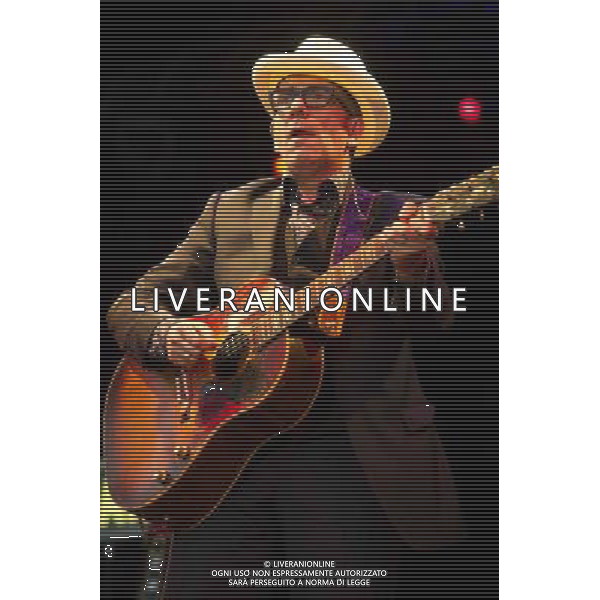 English singer-songwriter Elvis Costello performs at Kew Gardens, Richmond, Greater London, England, UK on Wednesday 16th July 2014 as part of the Kew The Music Series of concerts. Costello lived locally in Twickenham and the gig is billed as a homecoming gig. ©PHOTOSHOT/Agenzia Aldo Liverani sas - ITALY ONLY - EDITORIAL USE ONLY