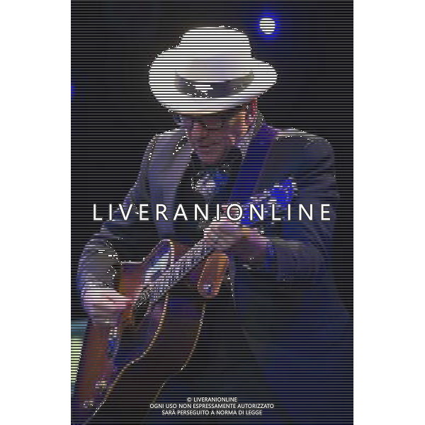 English singer-songwriter Elvis Costello performs at Kew Gardens, Richmond, Greater London, England, UK on Wednesday 16th July 2014 as part of the Kew The Music Series of concerts. Costello lived locally in Twickenham and the gig is billed as a homecoming gig. ©PHOTOSHOT/Agenzia Aldo Liverani sas - ITALY ONLY - EDITORIAL USE ONLY