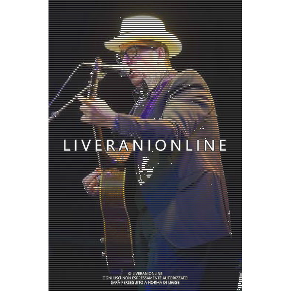 English singer-songwriter Elvis Costello performs at Kew Gardens, Richmond, Greater London, England, UK on Wednesday 16th July 2014 as part of the Kew The Music Series of concerts. Costello lived locally in Twickenham and the gig is billed as a homecoming gig. ©PHOTOSHOT/Agenzia Aldo Liverani sas - ITALY ONLY - EDITORIAL USE ONLY