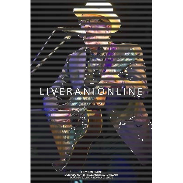 English singer-songwriter Elvis Costello performs at Kew Gardens, Richmond, Greater London, England, UK on Wednesday 16th July 2014 as part of the Kew The Music Series of concerts. Costello lived locally in Twickenham and the gig is billed as a homecoming gig. ©PHOTOSHOT/Agenzia Aldo Liverani sas - ITALY ONLY - EDITORIAL USE ONLY