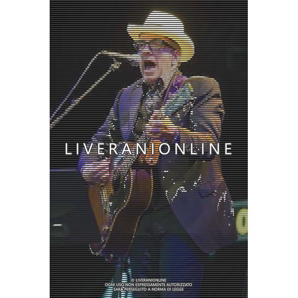 English singer-songwriter Elvis Costello performs at Kew Gardens, Richmond, Greater London, England, UK on Wednesday 16th July 2014 as part of the Kew The Music Series of concerts. Costello lived locally in Twickenham and the gig is billed as a homecoming gig. ©PHOTOSHOT/Agenzia Aldo Liverani sas - ITALY ONLY - EDITORIAL USE ONLY