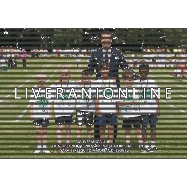 COVENTRY, ENGLAND - JULY 16: Prince William, Duke of Cambridge poses with children during an official visit to the Coventry War Memorial Park on July 16, 2014 in Coventry, England. The Duke made the visit to mark the Centenary of the First World War. () ©photoshot/Agenzia Aldo Liverani sas - ITALY ONLY - EDITORIAL USE ONLY - REALI INGLESI: Il Principe William, in visita al War Memorial Park, Coventry, il Parco dedicato al sacrificio di coloro che hanno perso la vita nella Grande Guerra, inghilterra 17 luglio 2014