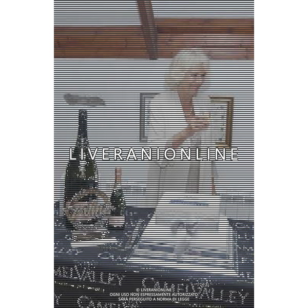 Picture by 16/07/14. HRH The Duchess of Cornwall enjoys a glass of Camel Valley wine whilst on a vist to the camel Valley Vineyard nr Bodmin,Cornwall. ©photoshot/Agenzia Aldo Liverani sas - ITALY ONLY - EDITORIAL USE ONLY - REALI INGLESI: Camilla Duchessa di Cornovaglia in visita alla Camel Valley Vineyard in Bodmin, Cornovaglia