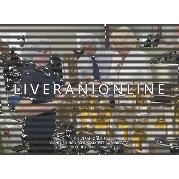 The Duchess of Cornwall toured Cornish Orchards, a company which produces apple juice and cider, meeting staff and learning about the production process, Westnorth Manor Farm, Duloe, Liskeard, Cornwall PL14 4PW.THE DUCHESS SIPS SOME CORNISH GOLD CIDER PICTURE ©photoshot/Agenzia Aldo Liverani sas - ITALY ONLY - EDITORIAL USE ONLY - REALI INGLESI: Il Principe Carlo d\'inghilterra con la moglie Camilla duchessa di Cornovaglia, ha visitato il mercato di via Looe
