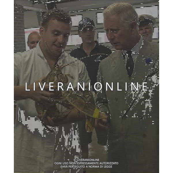 The Duke of Cornwall, President, Prince\'s Trust, and The Duchess of Cornwall toured Looe, where they met FISH MARKET PORTERS SAM CHAPMAN WITH A LARGE LOBSTER, AND SEAN COOMBER WITH THE SEA BREAM HELPED BY THE PRINCES TRUST . Picture: ©photoshot/Agenzia Aldo Liverani sas - ITALY ONLY - EDITORIAL USE ONLY - REALI INGLESI: Il Principe Carlo d\'inghilterra con la moglie Camilla duchessa di Cornovaglia, ha visitato il mercato di via Looe