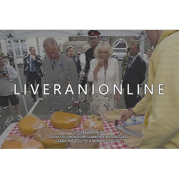 The Duke of Cornwall, President, Prince\'s Trust, and The Duchess of Cornwall toured Looe street market THE DUCHESS SAMPLES SOME CHEESE . Picture: ©photoshot/Agenzia Aldo Liverani sas - ITALY ONLY - EDITORIAL USE ONLY - REALI INGLESI: Il Principe Carlo d\'inghilterra con la moglie Camilla duchessa di Cornovaglia, ha visitato il mercato di via Looe