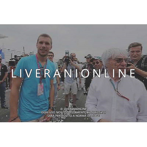 Lukas Podolski (GER) Football Player on the grid with Bernie Ecclestone (GBR). 20.07.2014. Formula 1 World Championship, Rd 10, German Grand Prix, Hockenheim, Germany, Race Day. - www.xpbimages.com, EMail: requests@xpbimages.com - copy of publication required for printed pictures. Every used picture is fee-liable. © Copyright: Charniaux / XPB Images - Gp F1 Germania gara /AGENZIA ALDO LIVERANI SAS - ITALY ONLY - EDITORIAL USE ONLY