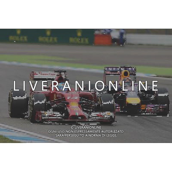 Fernando Alonso (ESP) Ferrari F14-T and Sebastian Vettel (GER) Red Bull Racing RB10 battle for position. 20.07.2014. Formula 1 World Championship, Rd 10, German Grand Prix, Hockenheim, Germany, Race Day. - www.xpbimages.com, EMail: requests@xpbimages.com - copy of publication required for printed pictures. Every used picture is fee-liable. Â© Copyright: Moy / XPB Images /AGENZIA ALDO LIVERANI SAS - ITALY ONLY - EDITORIAL USE ONLY - Gp F1 Germania gara