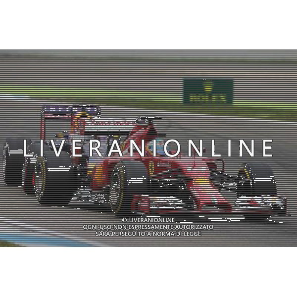 Fernando Alonso (ESP) Ferrari F14-T and Sebastian Vettel (GER) Red Bull Racing RB10 battle for position. 20.07.2014. Formula 1 World Championship, Rd 10, German Grand Prix, Hockenheim, Germany, Race Day. - www.xpbimages.com, EMail: requests@xpbimages.com - copy of publication required for printed pictures. Every used picture is fee-liable. Â© Copyright: Moy / XPB Images /AGENZIA ALDO LIVERANI SAS - ITALY ONLY - EDITORIAL USE ONLY - Gp F1 Germania gara