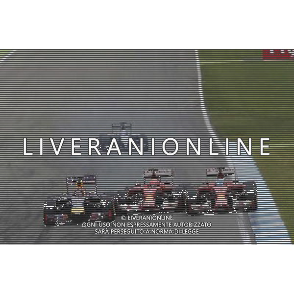 (L to R): Sebastian Vettel (GER) Red Bull Racing RB10, Kimi Raikkonen (FIN) Ferrari F14-T and Fernando Alonso (ESP) Ferrari F14-T battle for position. 20.07.2014. Formula 1 World Championship, Rd 10, German Grand Prix, Hockenheim, Germany, Race Day. - www.xpbimages.com, EMail: requests@xpbimages.com - copy of publication required for printed pictures. Every used picture is fee-liable. Â© Copyright: Trienitz / XPB Images /AGENZIA ALDO LIVERANI SAS - ITALY ONLY - EDITORIAL USE ONLY - Gp F1 Germania gara