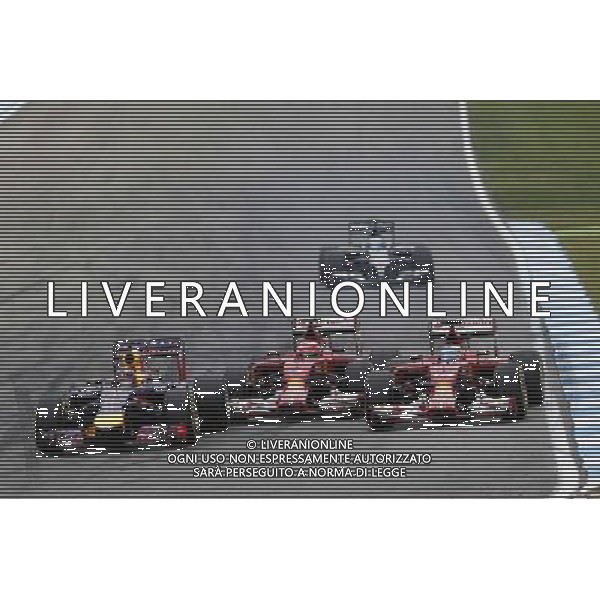 (L to R): Sebastian Vettel (GER) Red Bull Racing RB10, Kimi Raikkonen (FIN) Ferrari F14-T and Fernando Alonso (ESP) Ferrari F14-T battle for position. 20.07.2014. Formula 1 World Championship, Rd 10, German Grand Prix, Hockenheim, Germany, Race Day. - www.xpbimages.com, EMail: requests@xpbimages.com - copy of publication required for printed pictures. Every used picture is fee-liable. Â© Copyright: Trienitz / XPB Images /AGENZIA ALDO LIVERANI SAS - ITALY ONLY - EDITORIAL USE ONLY - Gp F1 Germania gara