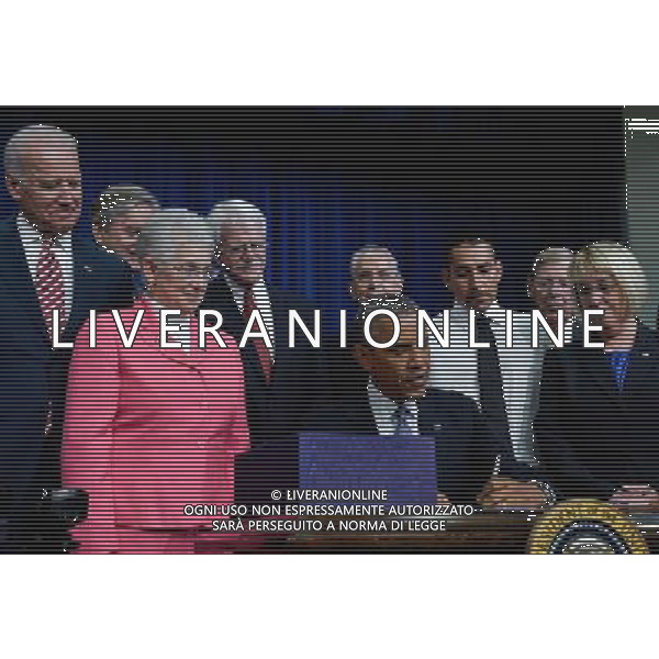 (140722)--WASHINGTON D.C., July 22, 2014 ()--U.S. President Barack Obama (C) signs the Workforce Innovation and Opportunity Act at White House in Washington D.C., capital of the United States, July 22, 2014. U.S. President Barack Obama singed H.R.803, the Workforce Innovation and Opportunity Act, which reauthorizes and reforms core workforce development programs administered by the Departments of Education and Labor and transfers from the Department of Education to the Department of Health and Human Services certain disability and independent living program functions, on Tuesday. (/Bao Dandan) ©PHOTOSHOT/AGENZIA ALDO LIVERANI SAS - ITALY ONLY - EDITORIAL USE ONLY