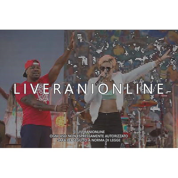 Rudimental perform on the Main Stage at T in the Park Festival, Balado, Scotland UK on 12th July 2014. Shown here DJ Locksmith ( Leon Rolle - red T-shirt) and Anna-Marie Nicholson ©PHOTOSHOT/AGENZIA ALDO LIVERANI SAS - ITALY ONLY - EDITORIAL USE ONLY