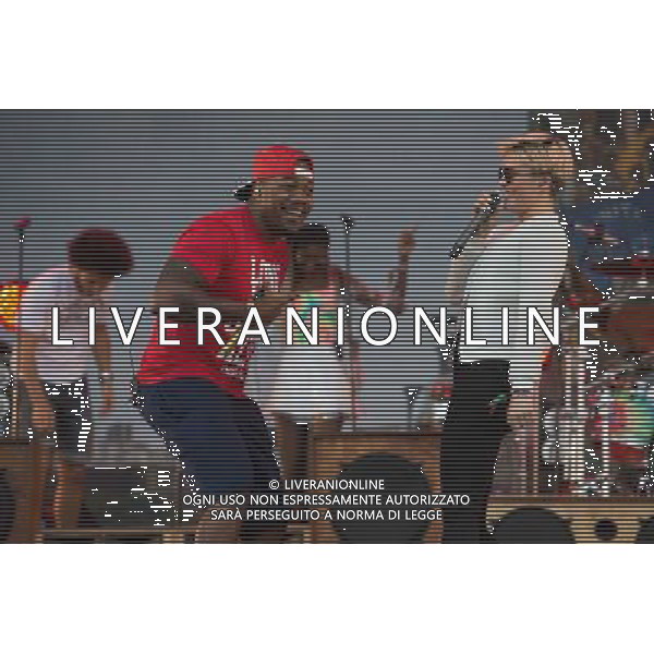 Rudimental perform on the Main Stage at T in the Park Festival, Balado, Scotland UK on 12th July 2014. Shown here DJ Locksmith ( Leon Rolle - red T-shirt) and Anna-Marie Nicholson ©PHOTOSHOT/AGENZIA ALDO LIVERANI SAS - ITALY ONLY - EDITORIAL USE ONLY