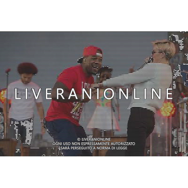 Rudimental perform on the Main Stage at T in the Park Festival, Balado, Scotland UK on 12th July 2014. Shown here DJ Locksmith ( Leon Rolle - red T-shirt) and Anna-Marie Nicholson ©PHOTOSHOT/AGENZIA ALDO LIVERANI SAS - ITALY ONLY - EDITORIAL USE ONLY