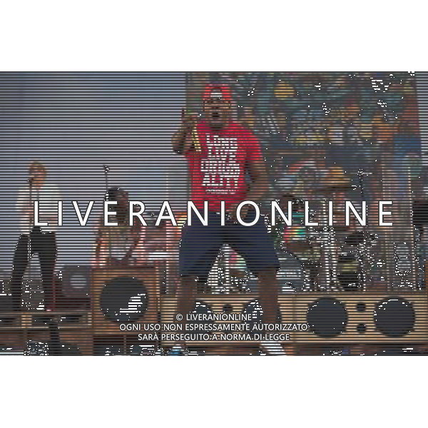 Rudimental perform on the Main Stage at T in the Park Festival, Balado, Scotland UK on 12th July 2014. Shown here DJ Locksmith ( Leon Rolle - red T-shirt) ©PHOTOSHOT/AGENZIA ALDO LIVERANI SAS - ITALY ONLY - EDITORIAL USE ONLY