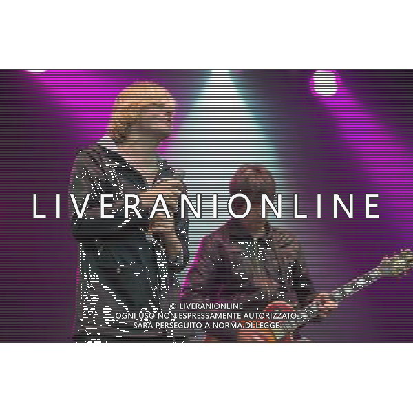 The Charlatans perform on the Radio 1 Stage T in the Park Festival, Balado, Scotland UK on 12th July 2014. The band consists of Tim Burgess (vocals), Mark Collins (guitar), Martin Blunt (bass guitar) ©PHOTOSHOT/AGENZIA ALDO LIVERANI SAS - ITALY ONLY - EDITORIAL USE ONLY