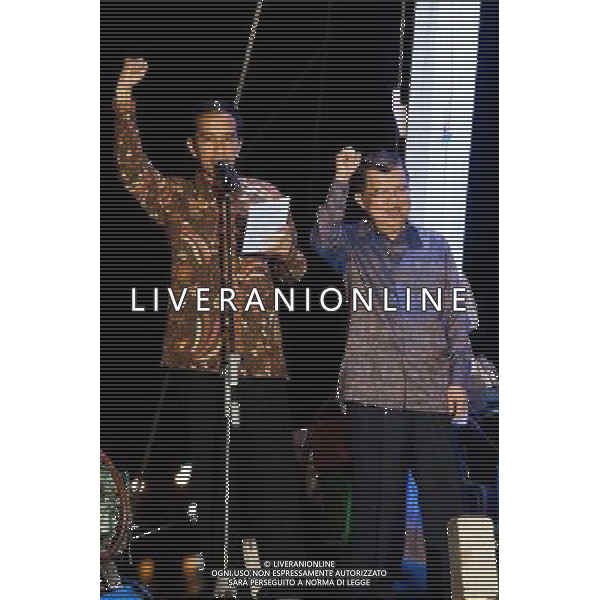 (140723) -- JAKARTA, July 23, 2014 () -- Indonesian presidential candidate Joko Widodo (L) and his running partner Jusuf Kalla gesture at Sunda Kelapa Port in Jakarta, capital of Indonesia, July 22, 2014. Jakarta Governor Joko Widodo was qualified to become the nation\'s new president after the General Election Commission settled the vote tally on Tuesday, showing Joko\'s domination against rival Prabowo Subianto. (/Veri Sanovri) ©photoshot/AGENZIA ALDO LIVERANI SAS - ITALY ONLY - EDITORIAL USE ONLY