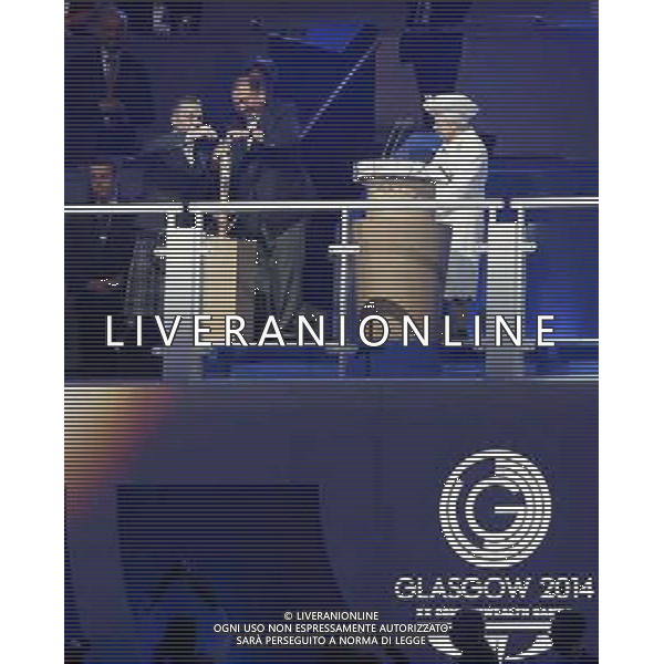 (140724) -- GLASGOW, July 24, 2014 () -- (From L to R) British six-time Olympic cyclist champion Sir Chris Hoy assists Prince Tunku Imran of Malaysia, president of the Commonwealth Games Federation to open the Queen\'s baton as Queen Elizabeth II looks on during the Opening Ceremony for the XX Commonwealth Games at the Celtic Park in Glasgow, Britain, on July 23, 2014. (/Wang Lili) ©photoshot/AGENZIA ALDO LIVERANI SAS - ITALY ONLY - EDITORIAL USE ONLY