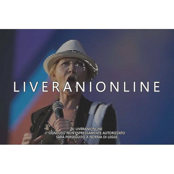 GLASGOW GREEN CONCERT FOR THE OPENING NIGHT COMMONWEALTH GAMES. Lulu on stage and with the unicef kids ©photoshot/AGENZIA ALDO LIVERANI SAS - ITALY ONLY - EDITORIAL USE ONLY