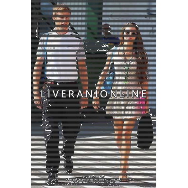 Jenson Button (GBR) McLaren with his girlfriend Jessica Michibata (JPN). 26.07.2014. Formula 1 World Championship, Rd 11, Hungarian Grand Prix, Budapest, Hungary, Qualifying Day. - www.xpbimages.com, EMail: requests@xpbimages.com - copy of publication required for printed pictures. Every used picture is fee-liable. © Copyright: Moy / XPB Images /AGENZIA ALDO LIVERANI SAS - ITALY ONLY - EDITORIAL USE ONLY - Gp F1 Ungheria Prove ufficiali